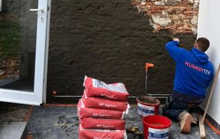 travaux de cimentage mur humide